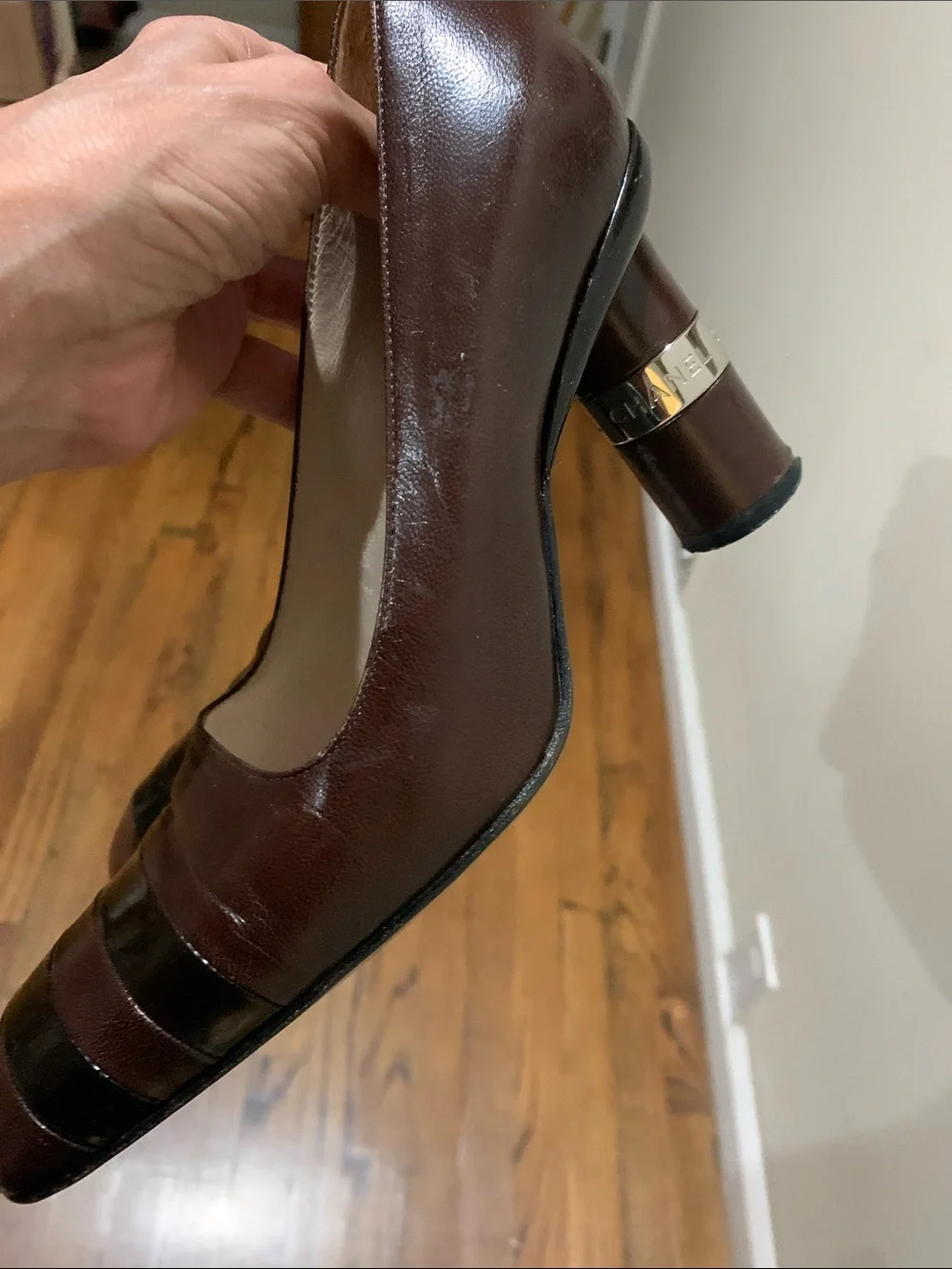 CHANEL Brown Leather Low Heel Pumps with Black Toe Stripes
